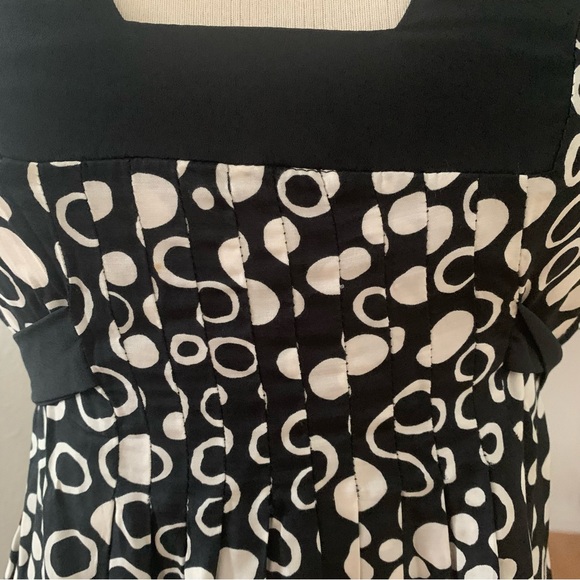 Le Lis Blanc Deux Sleeveless mini dress; black background with cream polka dots - Picture 2 of 9